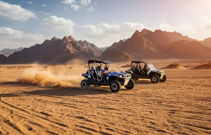 "Family in a 4-seater buggy racing across Sharm El Sheikh's desert and kicking up sand with Sinai mountains behind