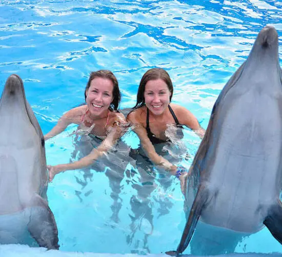 happy girls after swimming with the dolphin at sharm blue excursions