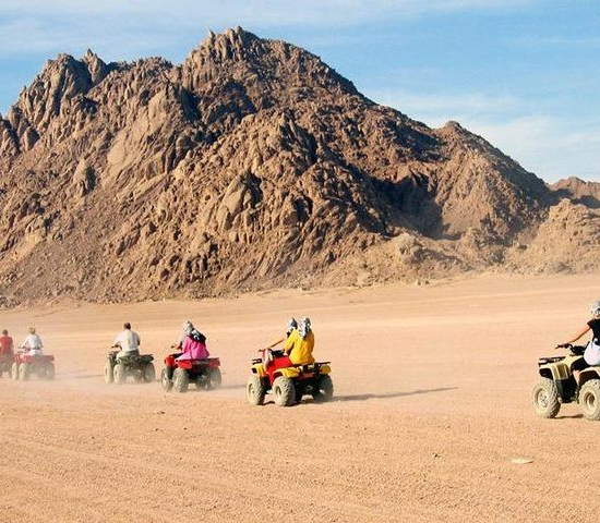 A group of quad bikers riding through Sharm El Sheikh desert